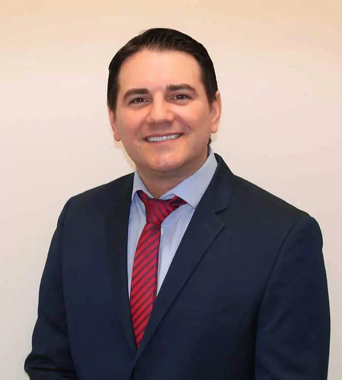 Dr. Michael Pechan during a patient consultation at Elite Boca Dental